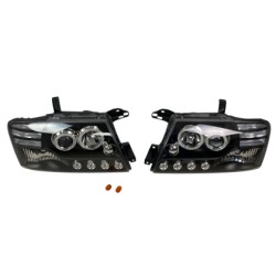 Φανάρια εμπρός Mitsubishi Pajero (2001-2006) - μαύρα , με λάμπες (Η1) - σετ 2τμχ.